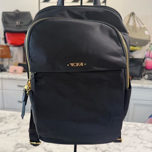 Tumi Handbags - TUMI Black and Gold Voyageur - Small Daniella Backpack